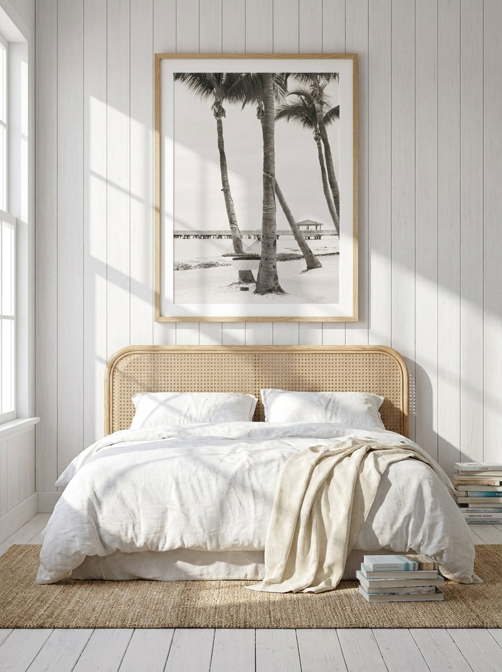 Modern wall art print styled on the wall in a coastal bedroom