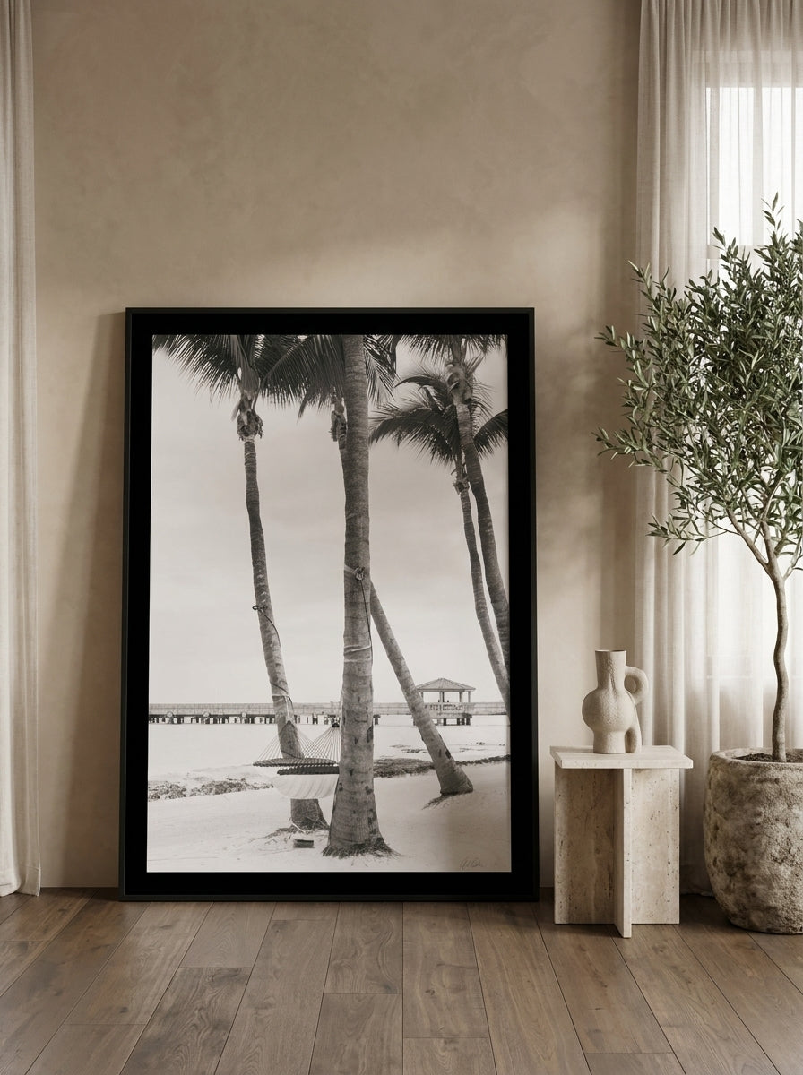 Oversized statement modern wall art print leaning against the wall in a luxe living room