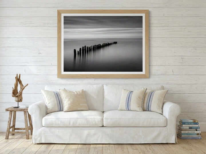 Modern wall art print styled on the wall in a coastal living room
