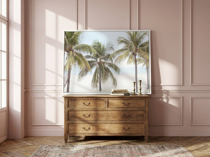 Canvas wall art with a white surround standing on a sideboard in a Parisian bathroom