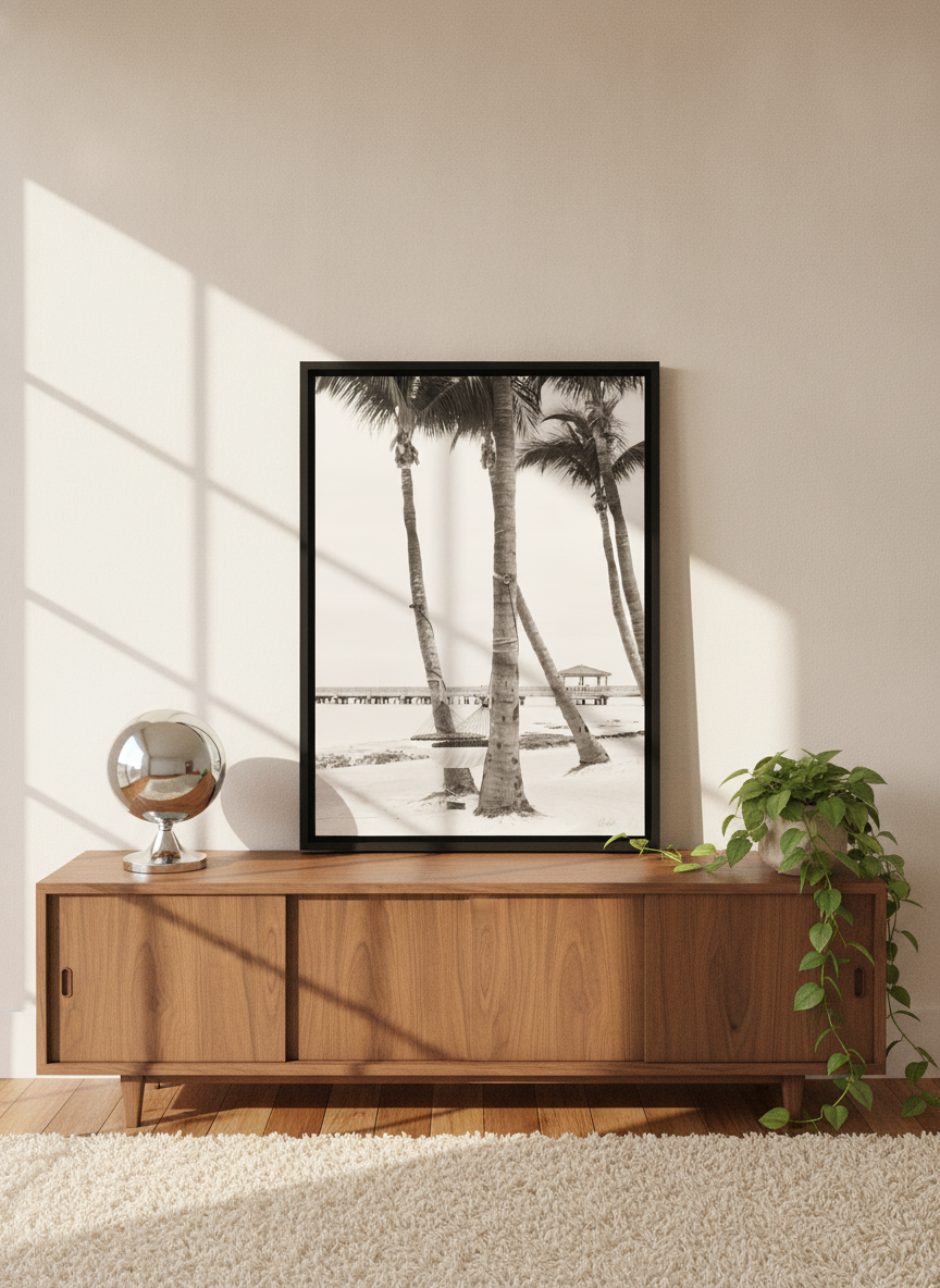 Canvas wall art with a black surround standing on a sideboard in a retro 70s home office