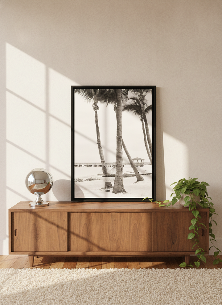 Canvas wall art with a black surround standing on a sideboard in a retro 70s home office