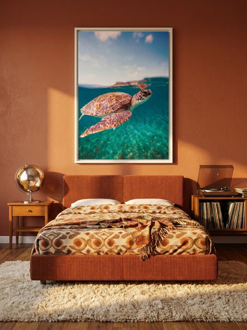 Canvas wall art with a white surround styled on the wall in a retro 70s bedroom