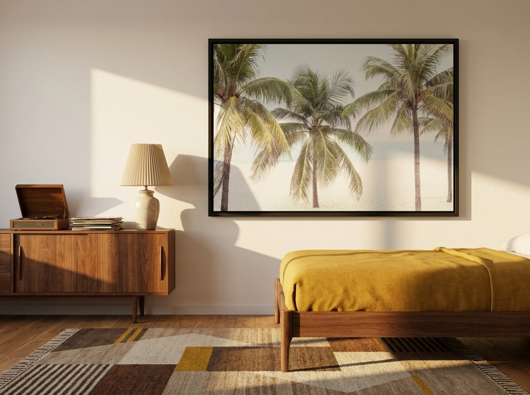 Canvas wall art with a black surround styled on the wall in a mid-century bedroom