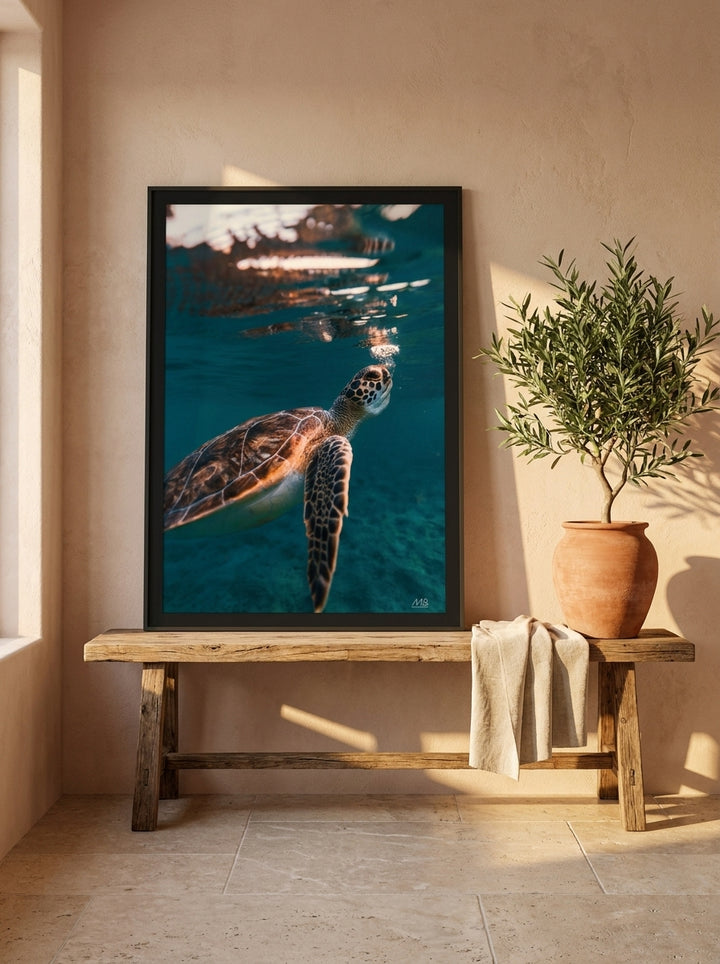 Modern wall art print standing on a bench in a Mediterranean bathroom