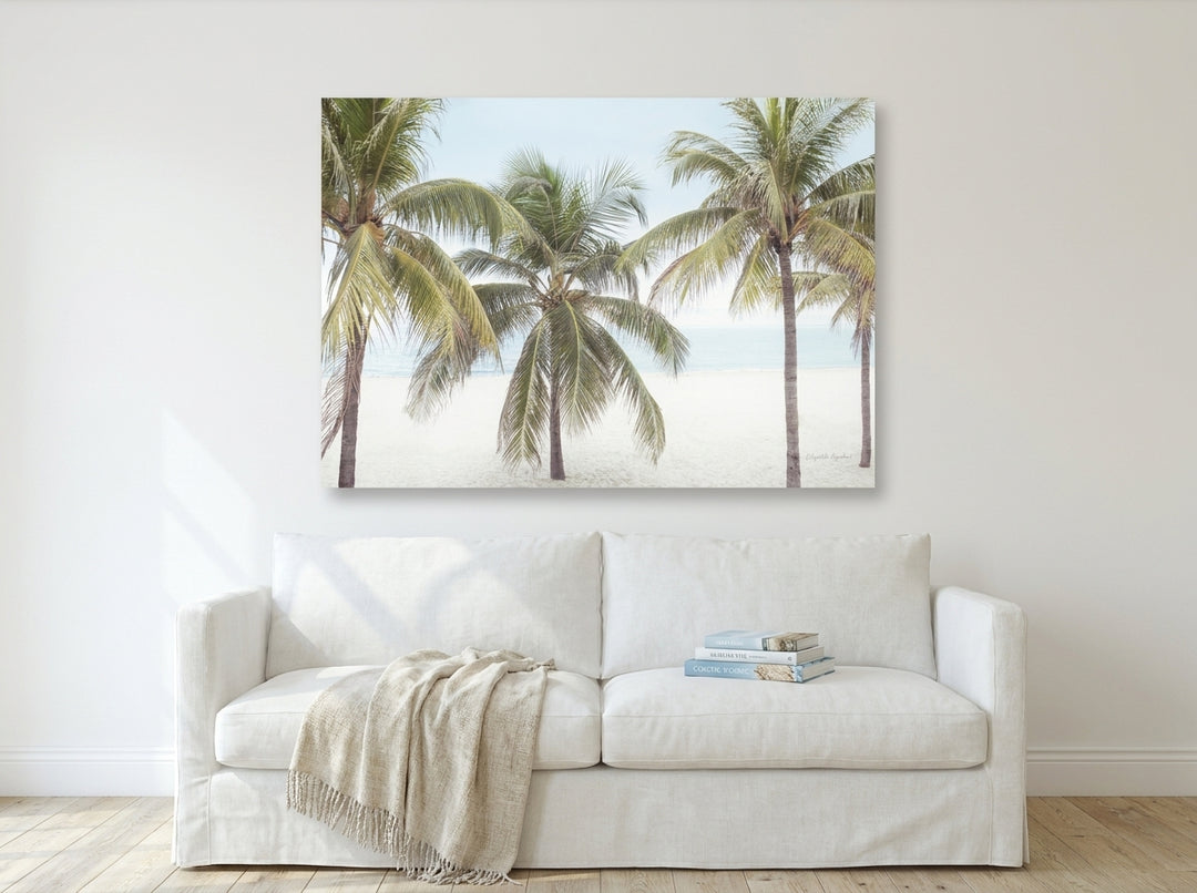 Stretched canvas wall art styled on the wall in a coastal living room