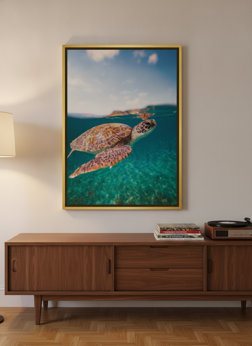 Canvas wall art with a gold leaf surround standing on a sideboard in a mid-century home office