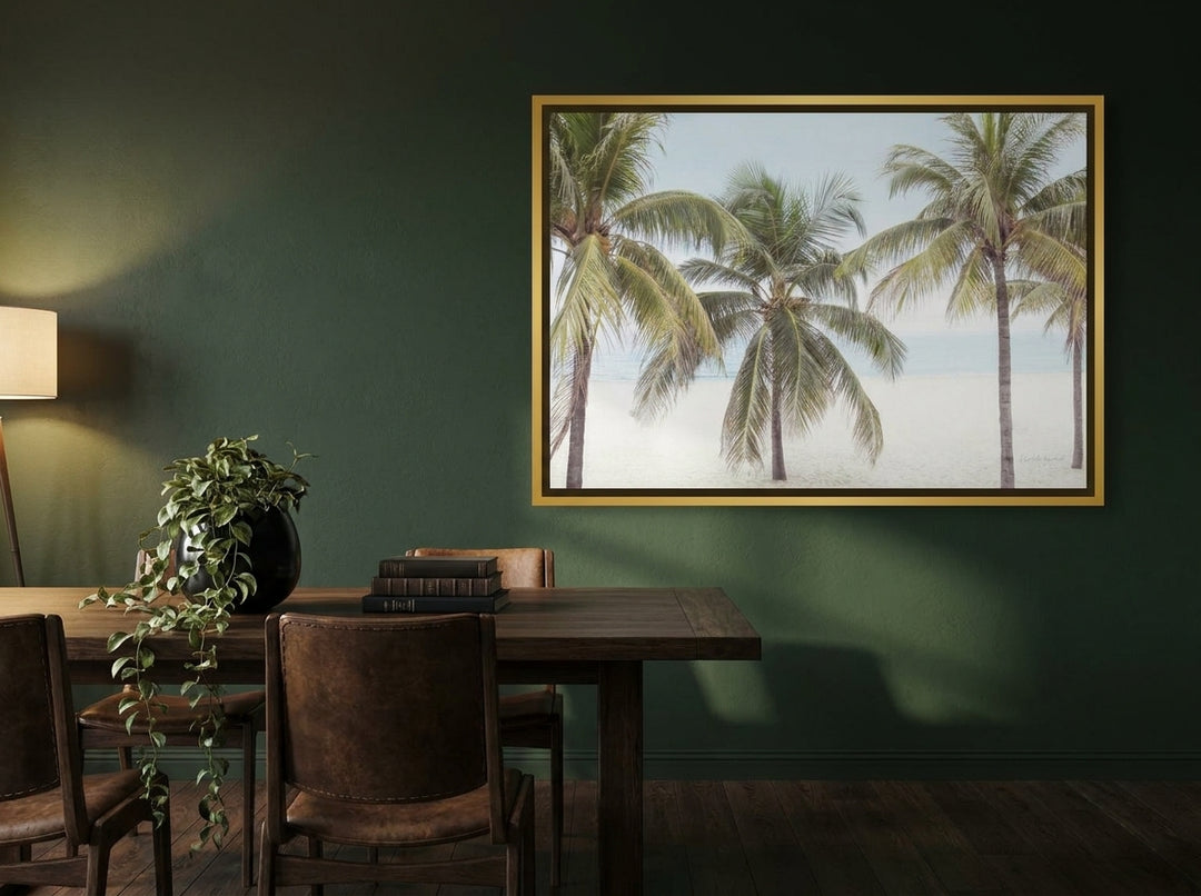 Oversized statement canvas wall art with a gold leaf surround styled on the wall in a moody dining room