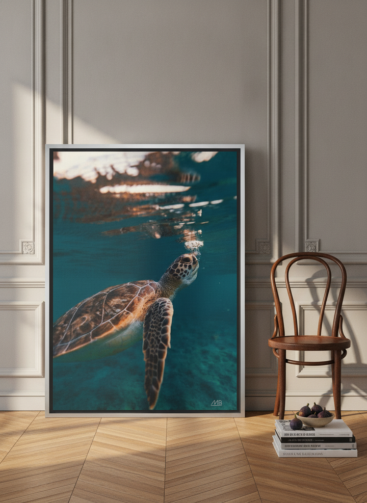 Canvas wall art with a silver leaf surround leaning against the wall in a Parisian kitchen