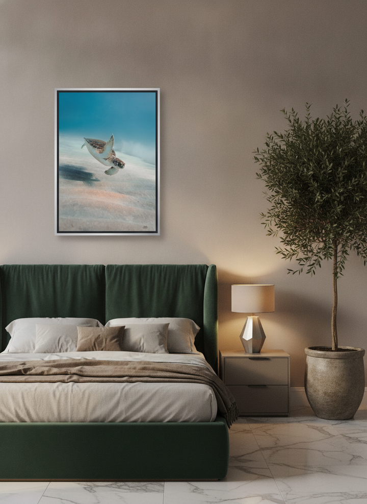 Oversized statement canvas wall art with a silver leaf surround styled on the wall in a luxe bedroom