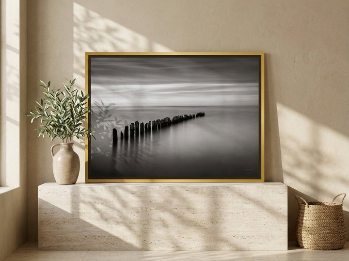 Canvas wall art with a gold leaf surround standing on a console in a Mediterranean home office
