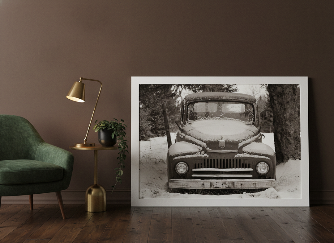 Modern wall art print leaning against the wall in a moody bedroom