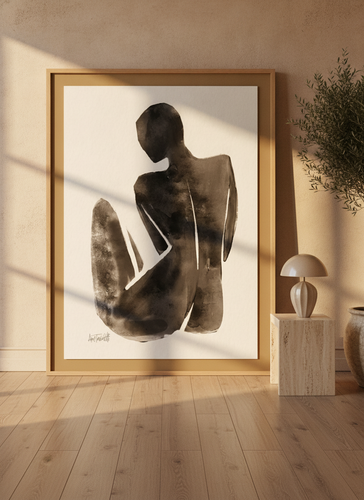 Oversized statement modern wall art print leaning against the wall in a luxe living room