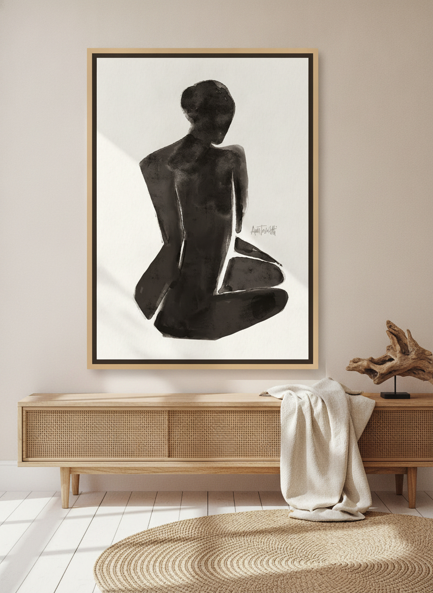 Canvas wall art with a natural timber surround standing on a sideboard in a coastal home office