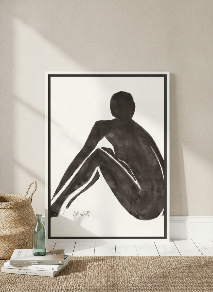 Canvas wall art with a white surround leaning against the wall in a coastal bathroom