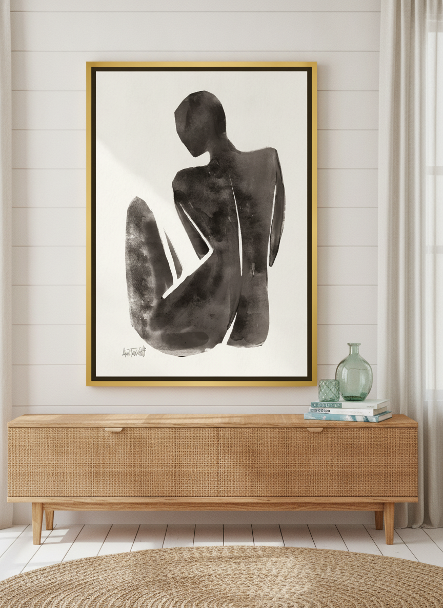Canvas wall art with a gold leaf surround standing on a sideboard in a coastal home office