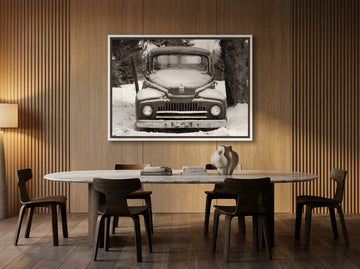 Canvas wall art with a white surround styled on the wall in a luxe dining room