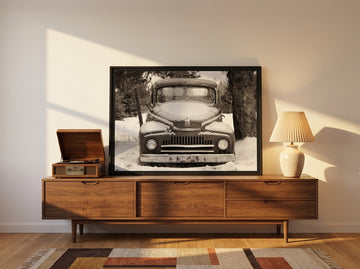 Modern wall art print standing on a sideboard in a mid-century home office