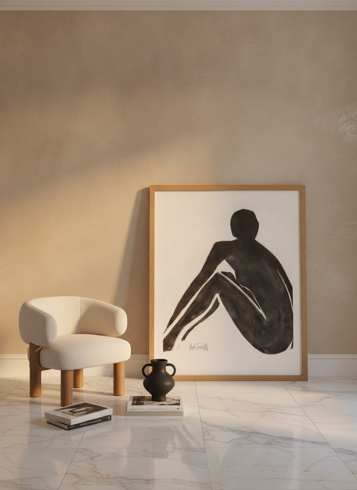 Oversized statement modern wall art print leaning against the wall in a luxe dining room