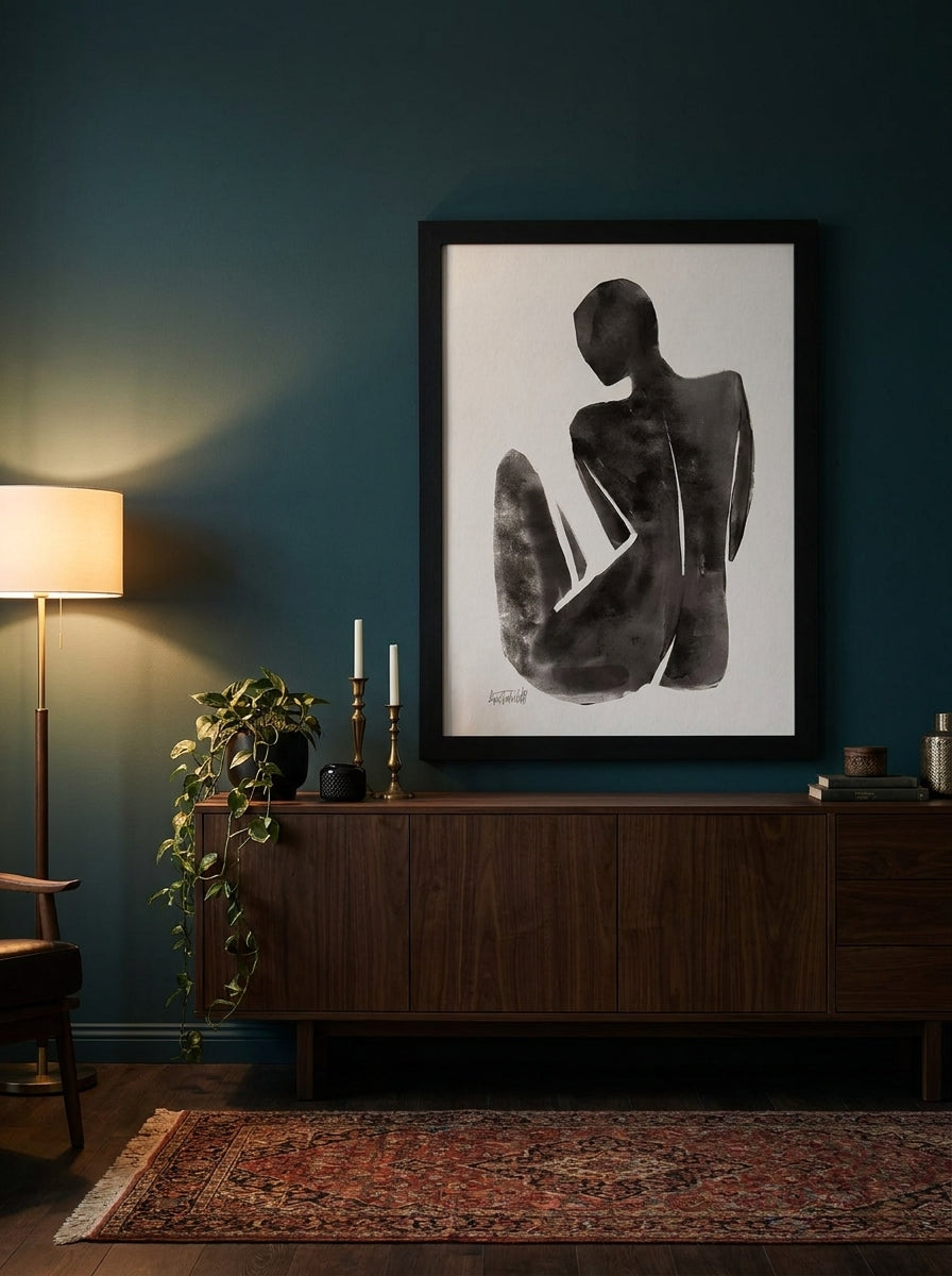 Oversized statement modern wall art print styled on the wall in a moody living room