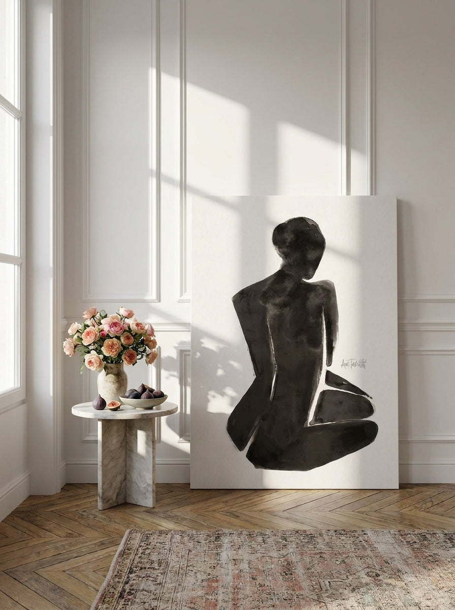 Stretched canvas wall art leaning against the wall in a Parisian living room
