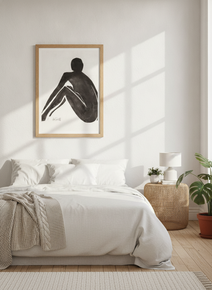 Modern wall art print styled on the wall in a bright Scandinavian bedroom