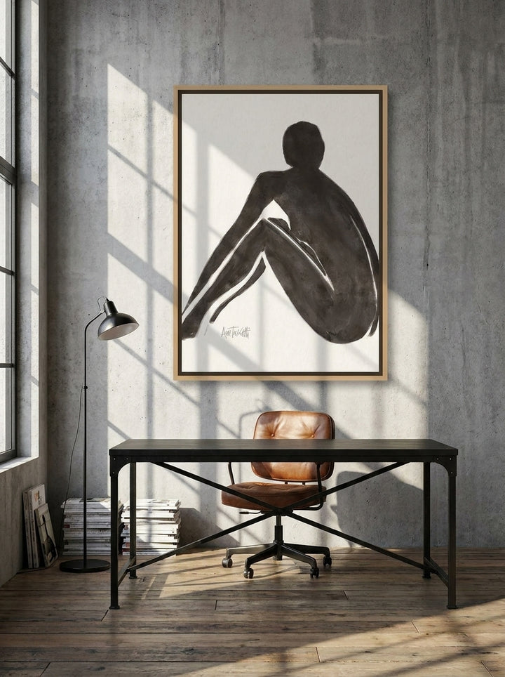 Canvas wall art with a natural timber surround styled on the wall in an industrial loft home office