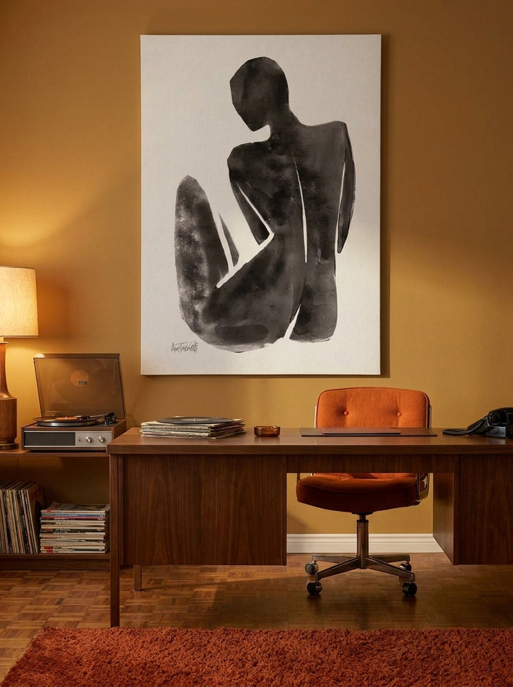 Stretched canvas wall art styled on the wall in a retro 70s home office
