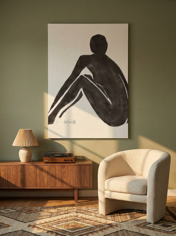 Stretched canvas wall art styled on the wall in a mid-century living room