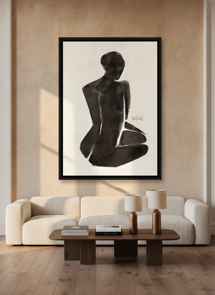 Oversized statement canvas wall art with a black surround styled on the wall in a luxe living room