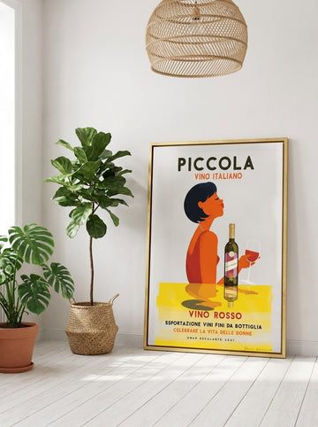 Canvas wall art with a gold leaf surround leaning against the wall in a bright Scandinavian living room