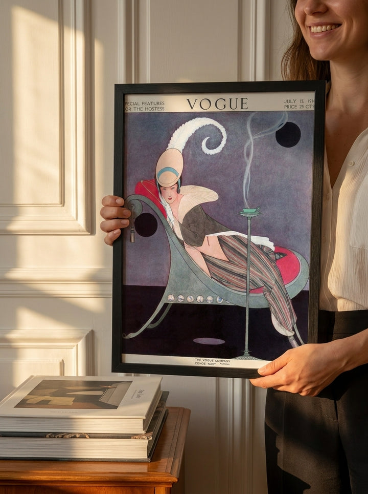 Person holding modern wall art print in a Parisian living room