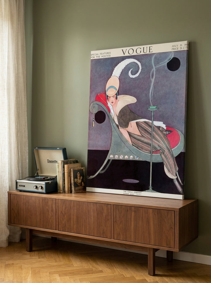 Stretched canvas wall art standing on a sideboard in a mid-century living room