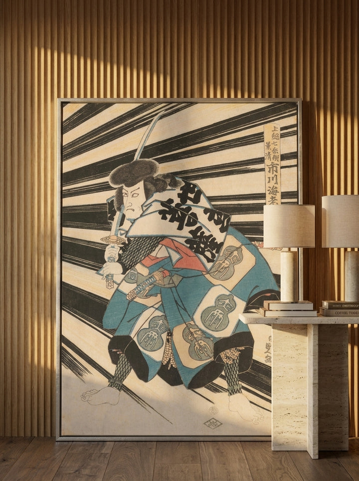 Oversized statement canvas wall art with a silver leaf surround leaning against the wall in a luxe dining room