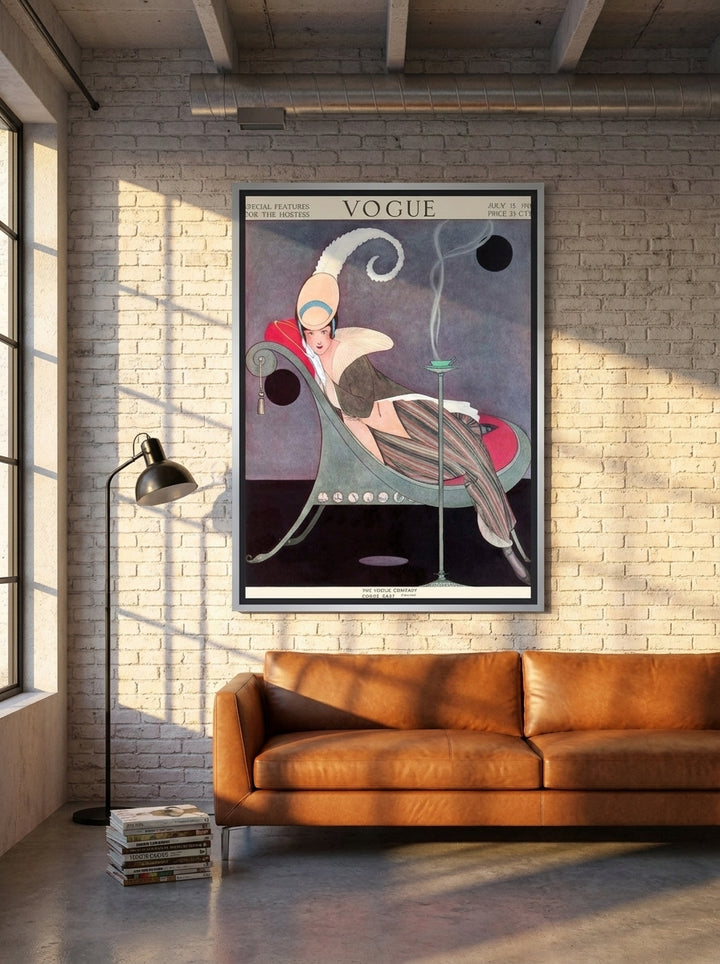 Oversized statement canvas wall art with a silver leaf surround styled on the wall in an industrial loft living room