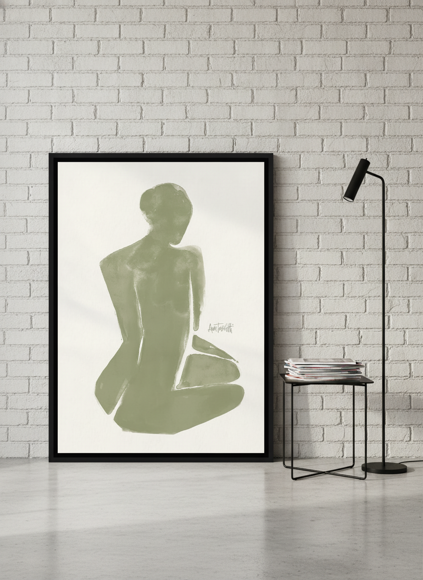 Canvas wall art with a black surround leaning against the wall in an industrial loft home office