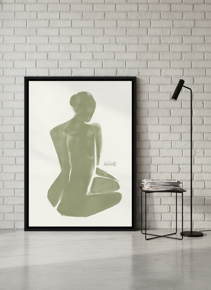 Canvas wall art with a black surround leaning against the wall in an industrial loft home office