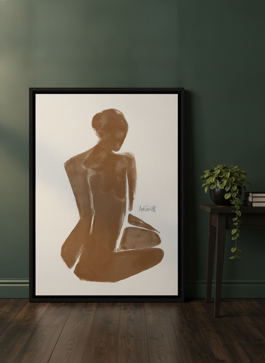 Canvas wall art with a black surround leaning against the wall in a moody home office