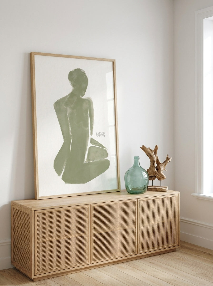 Modern wall art print standing on a sideboard in a coastal home office