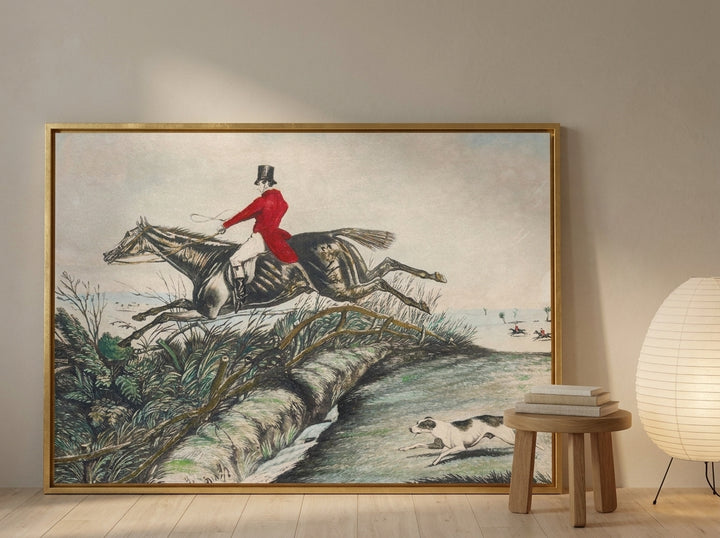 Oversized statement canvas wall art with a gold leaf surround leaning against the wall in a warm Japandi dining room