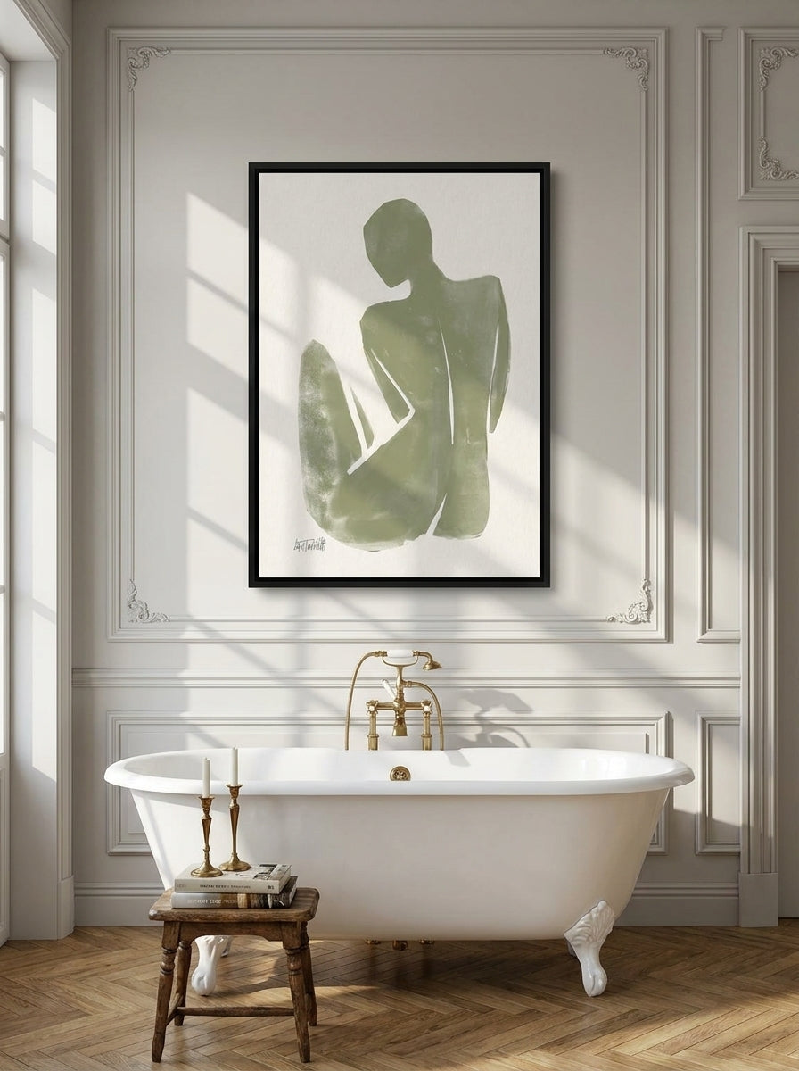 Canvas wall art with a black surround styled on the wall in a Parisian bathroom