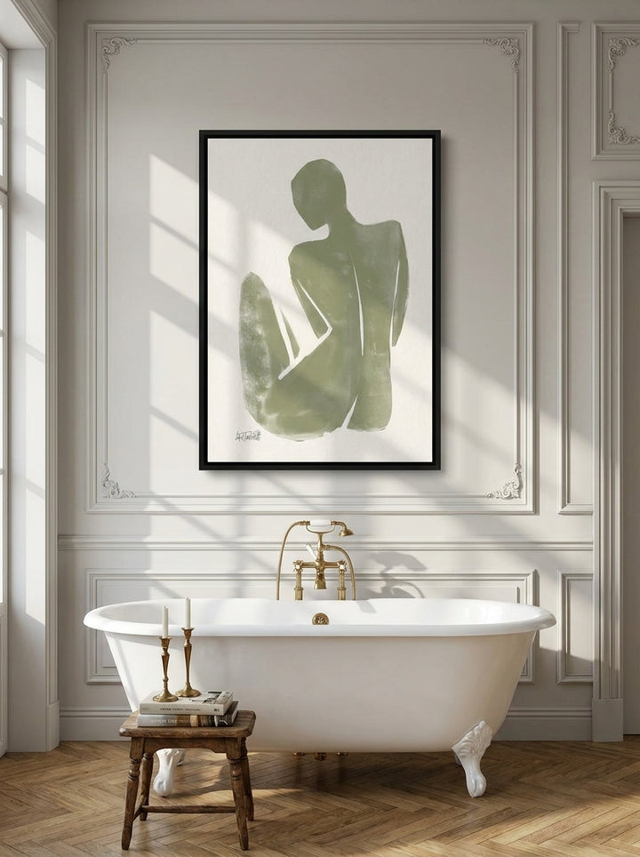 Canvas wall art with a black surround styled on the wall in a Parisian bathroom