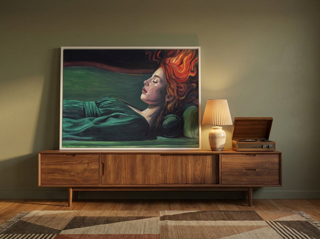 Modern wall art print standing on a sideboard in a mid-century living room