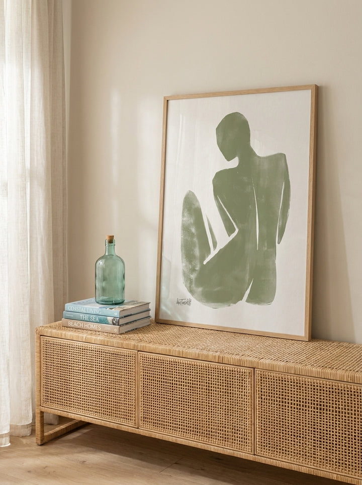Modern wall art print standing on a sideboard in a coastal bathroom