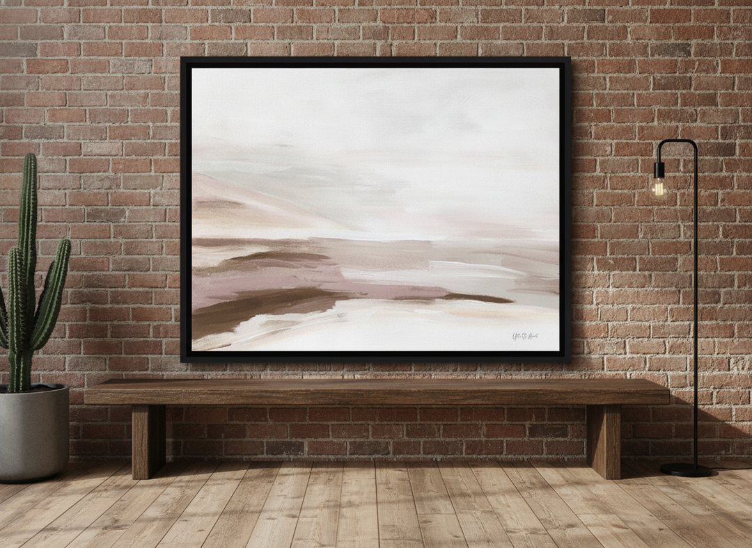 Canvas wall art with a black surround standing on a bench in an industrial loft home office