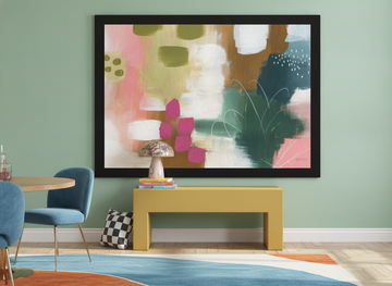 Modern wall art print standing on a side table in a colourful eclectic dining room