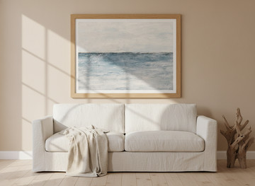 Modern wall art print styled on the wall in a coastal living room