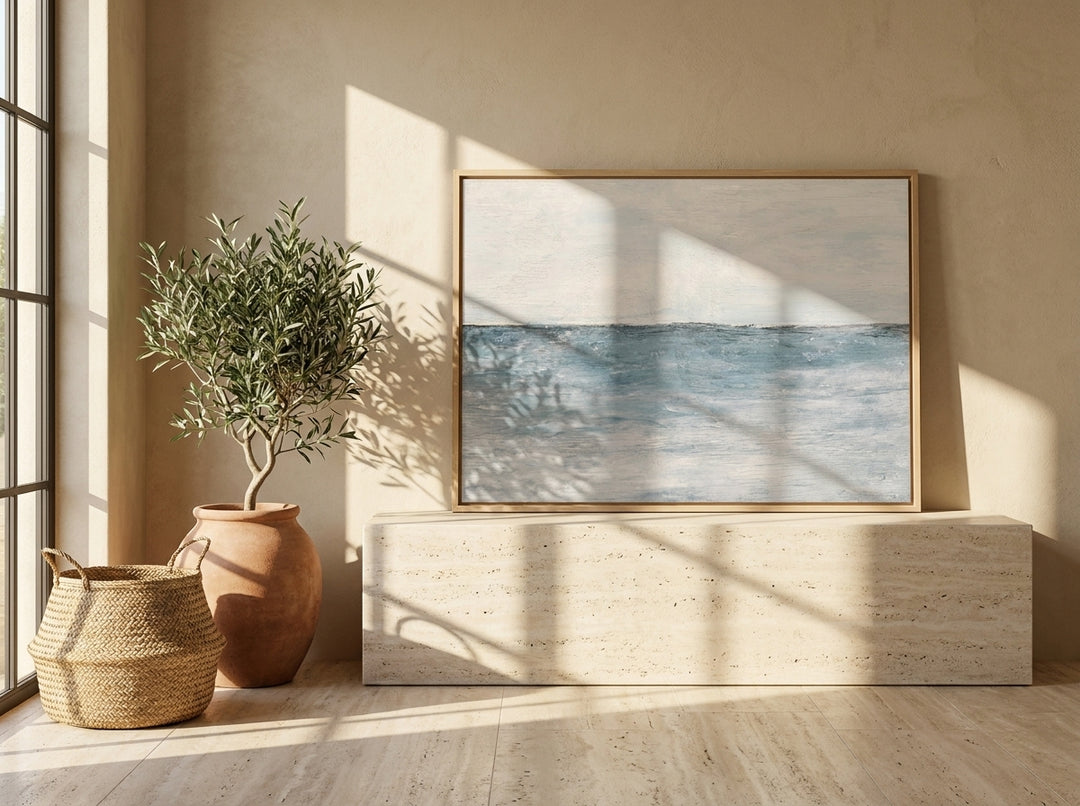 Modern wall art print standing on a console in a Mediterranean bathroom