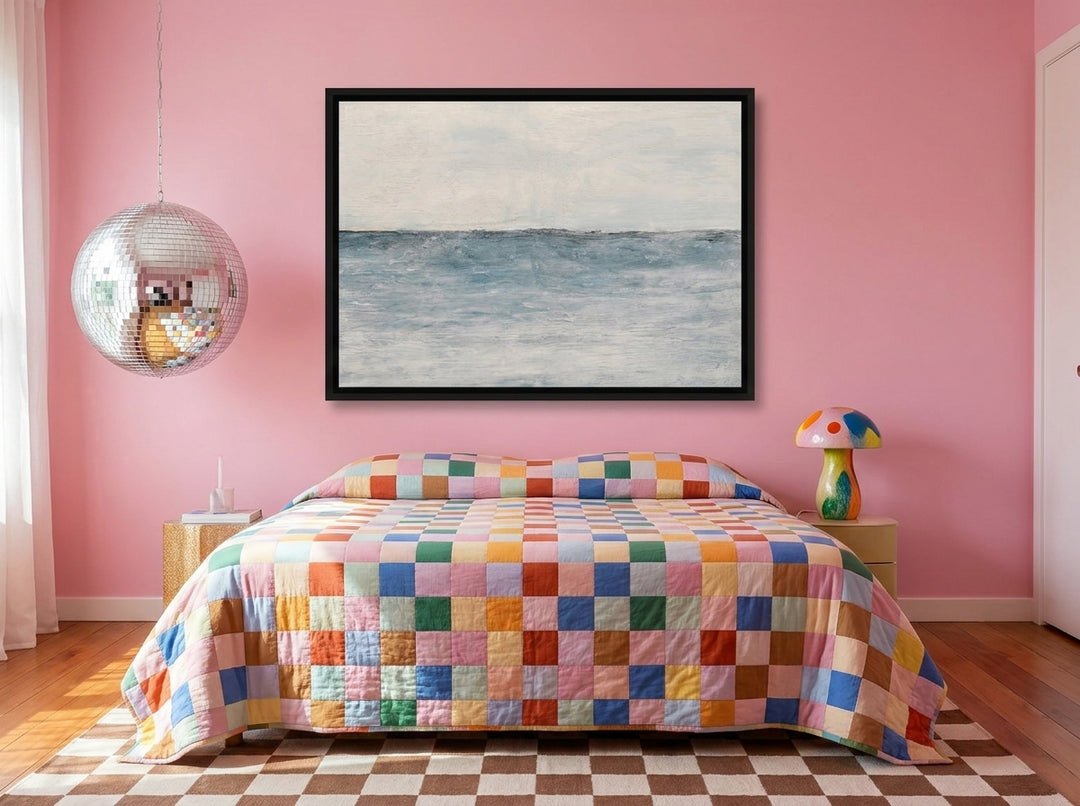 Canvas wall art with a black surround styled on the wall in a colourful eclectic bedroom