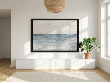 Oversized statement modern wall art print styled on the wall in a bright Scandinavian living room